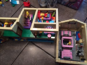 A bird's eye view of Bart's room and part of Lisa's, as well as the garage. Grandpa is apparently over for a visit.